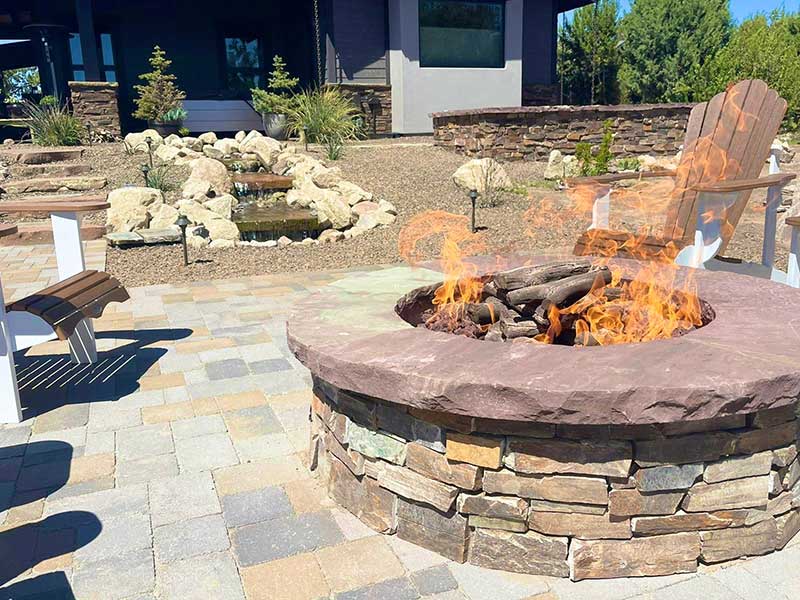 Custom Built Rock Fire Pit in Backyard